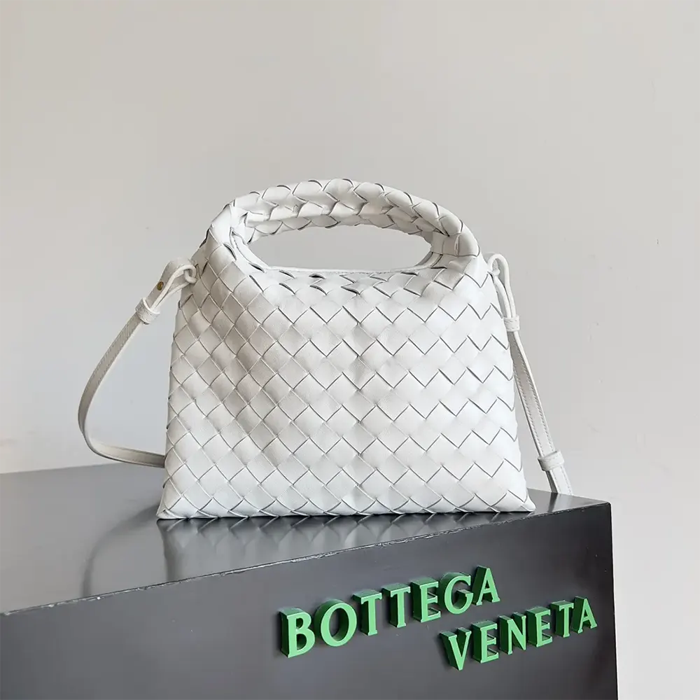 Close-up of gold-tone hardware on Bottega Veneta Women Mini Hop white bag