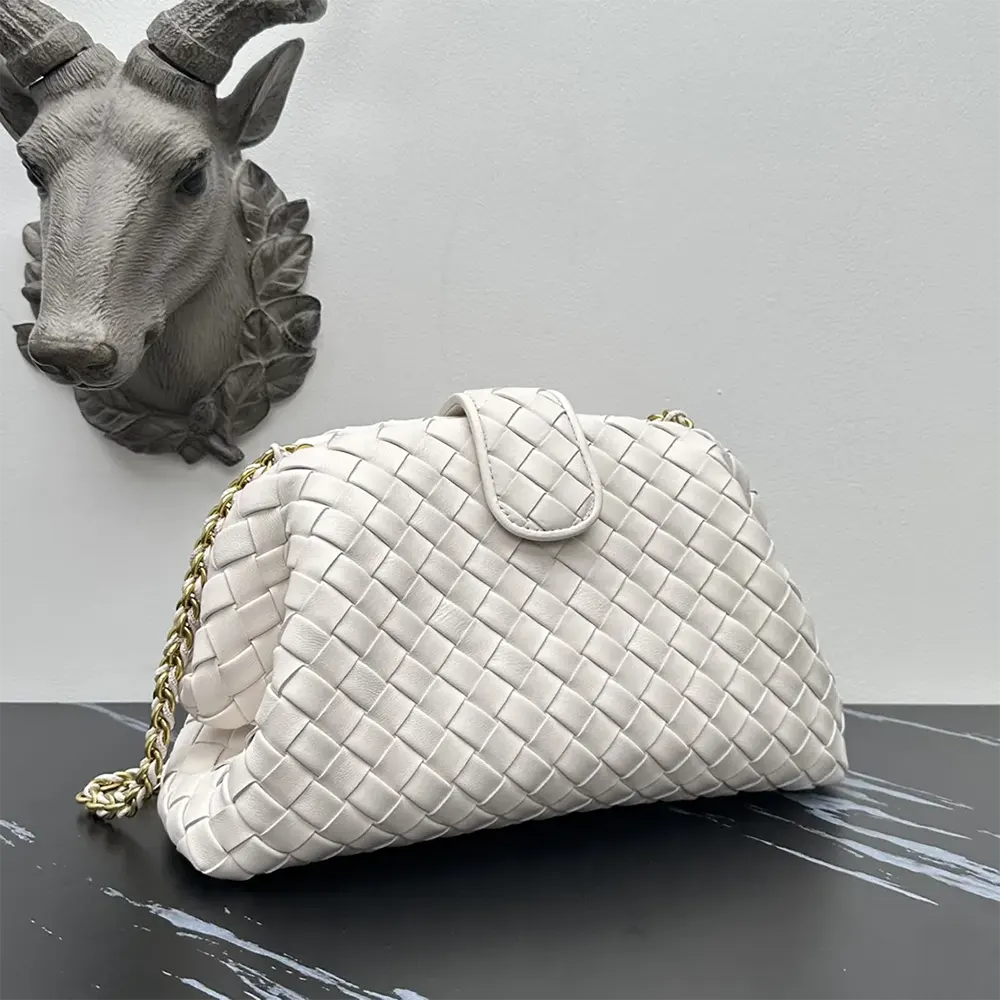 Side angle showing structured silhouette of Bottega Veneta Teen Lauren 1980 White bag