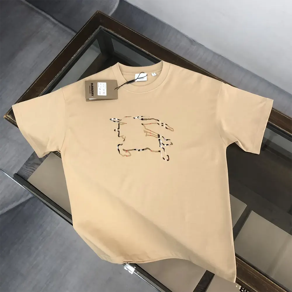 Close-up of Burberry check detail on chest of sandy cotton T-shirt