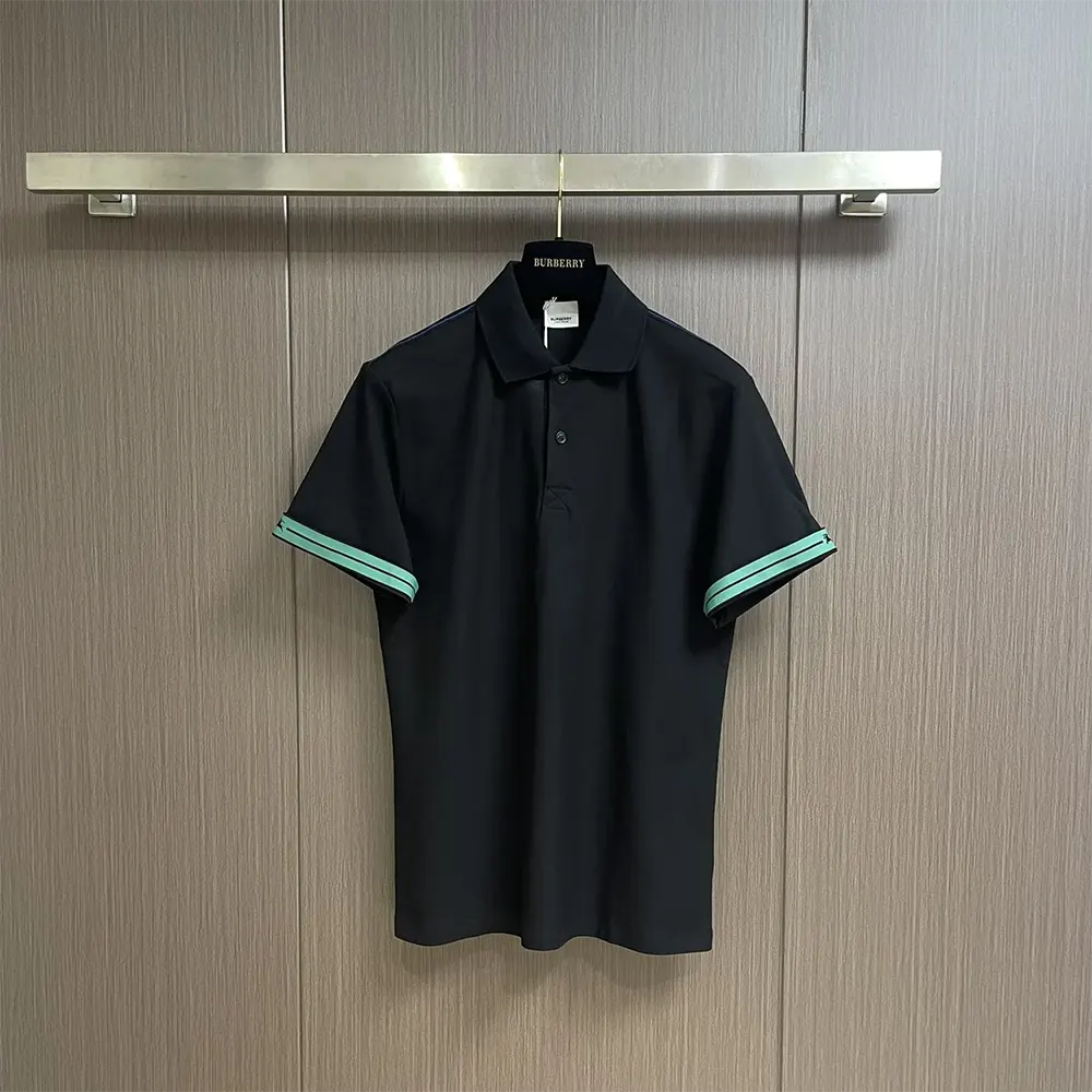 Close-up detail of Burberry logo on black cotton polo shirt
