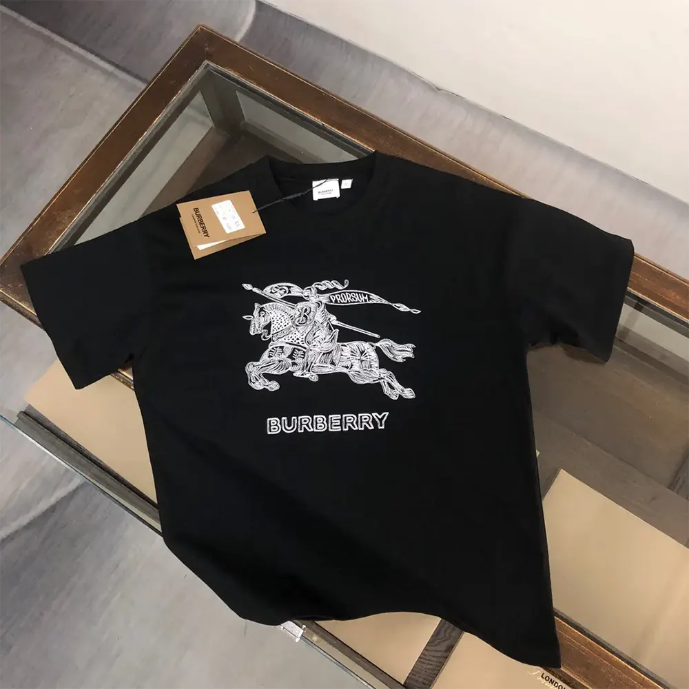 Close-up of signature Burberry logo on black cotton T-shirt
