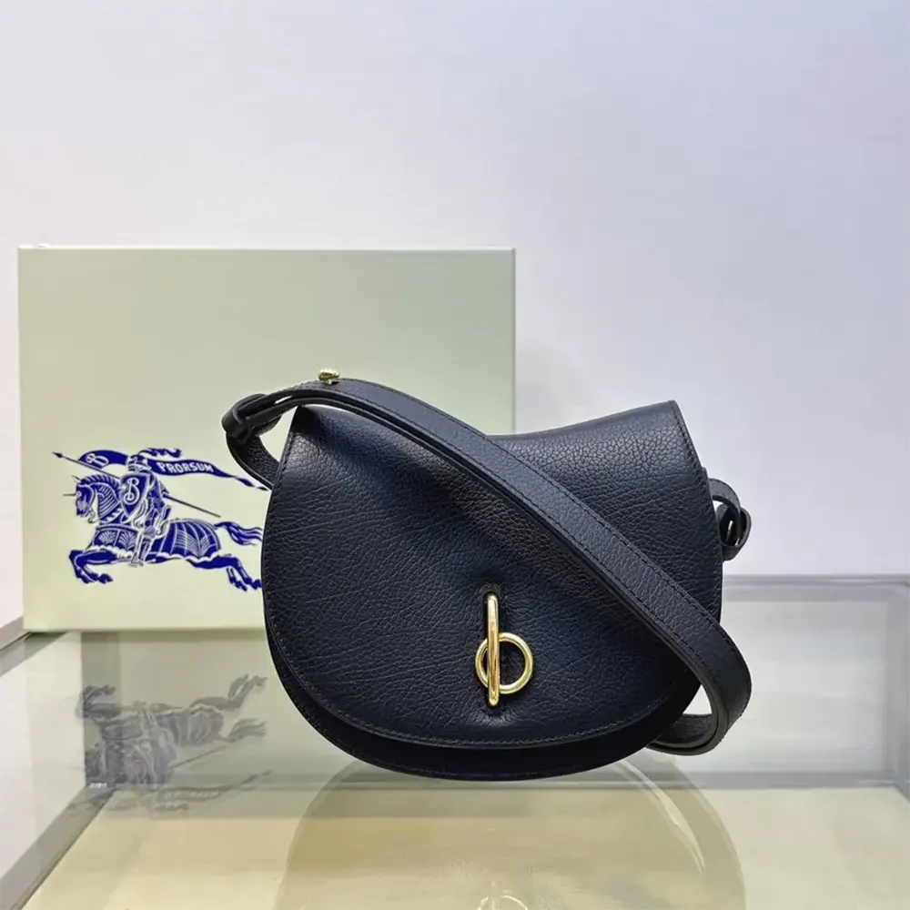 Close-up of silver-tone hardware and Burberry logo on Mini Rocking Horse Bag-Black