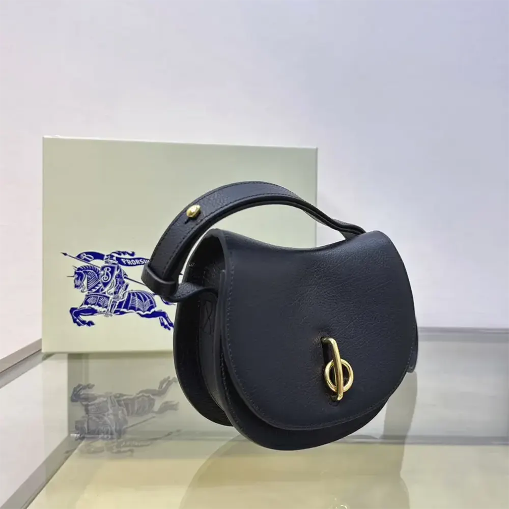 Side angle showing adjustable shoulder strap on Burberry Women Mini Rocking Horse Bag-Black