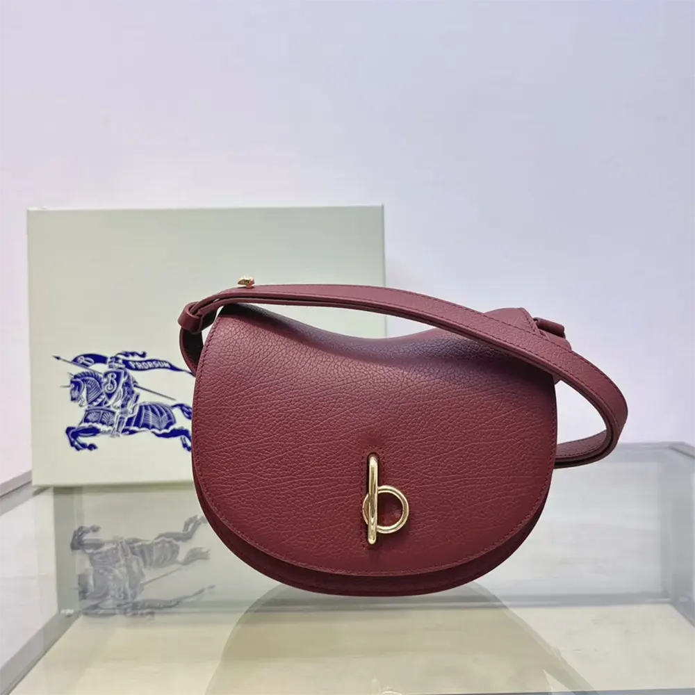 Close-up of Rocking Horse hardware on Burberry Women Mini Rocking Horse Bag-Maroon