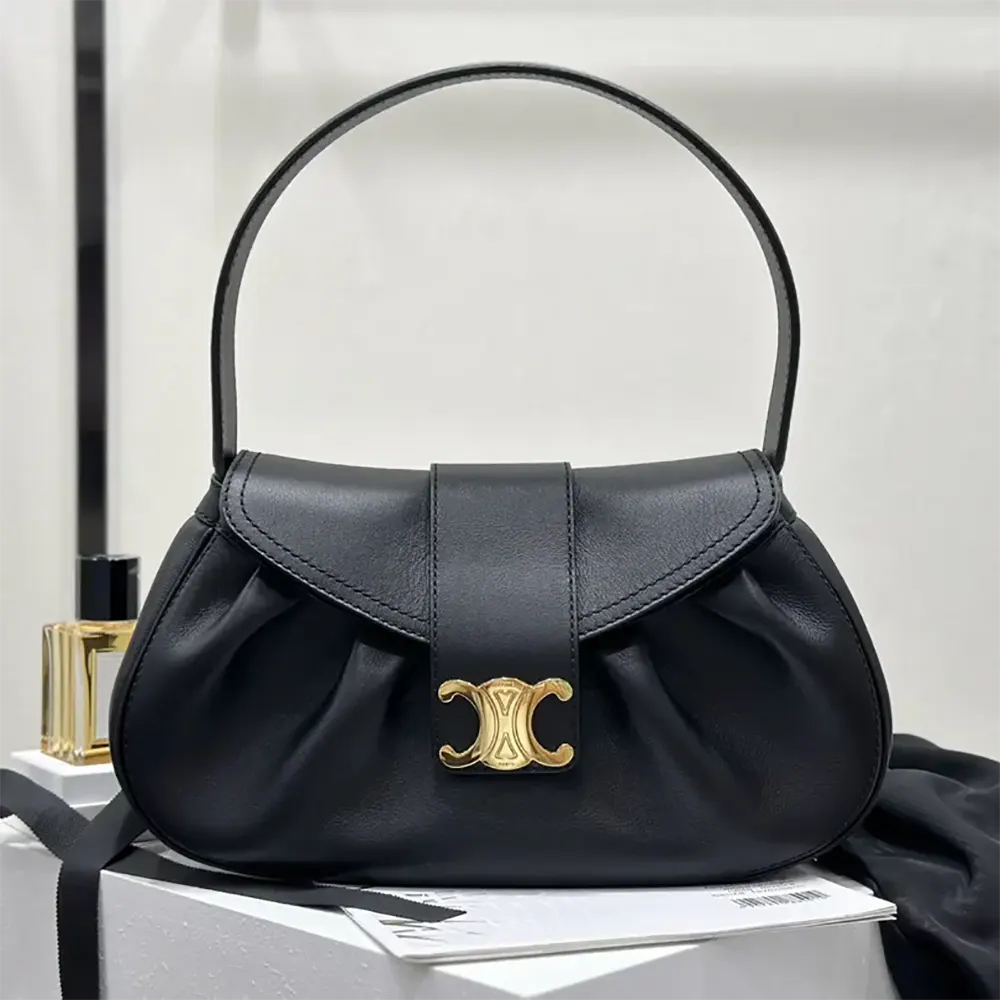 Close-up of gold-tone hardware on Celine Women Medium Polly Bag