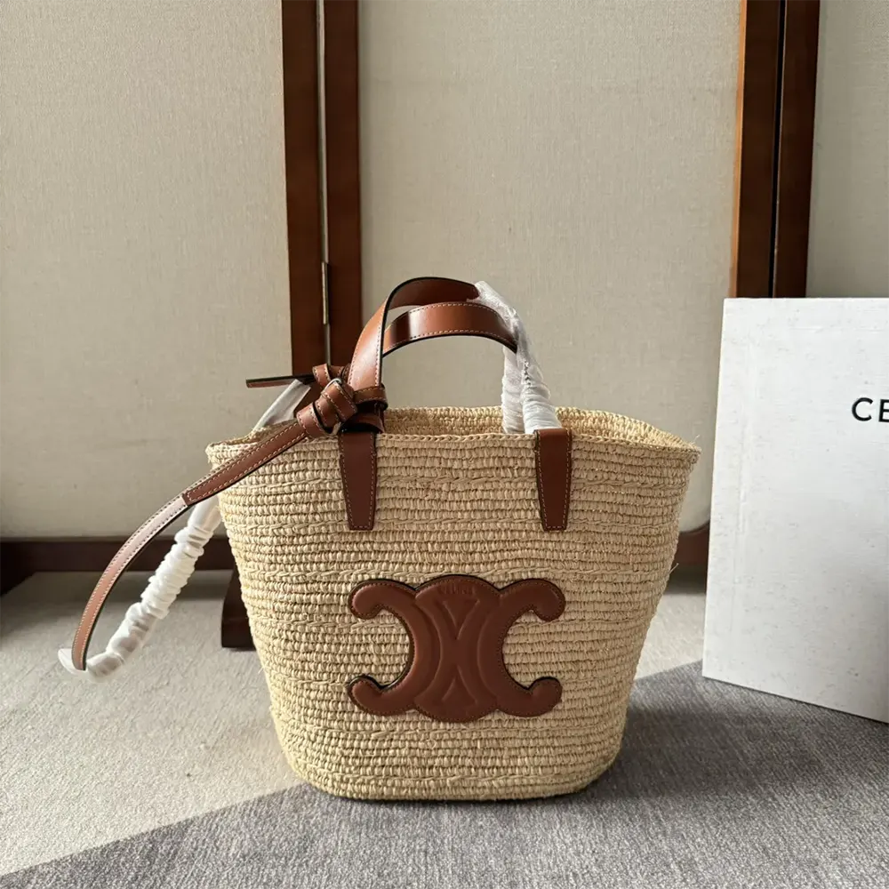 Close-up of tan calfskin leather handle and gold hardware on Celine Classic Panier