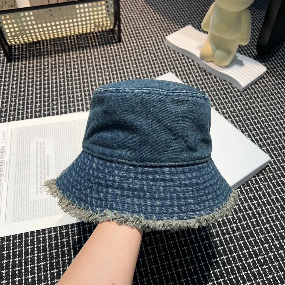 Side view showing silhouette of Celine Women Triomphe Bucket Hat navy denim