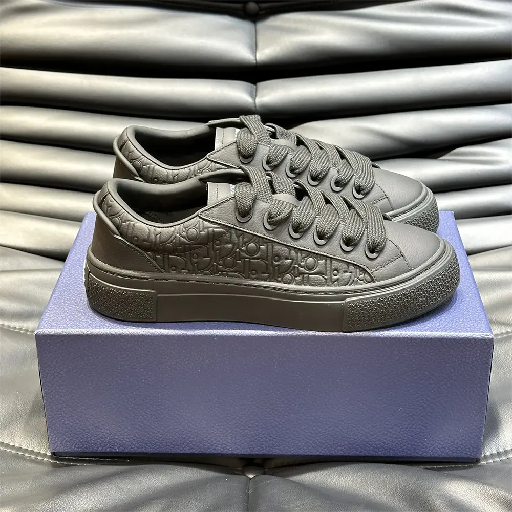 Close-up on black grained calfskin and Dior logo detail on sneaker