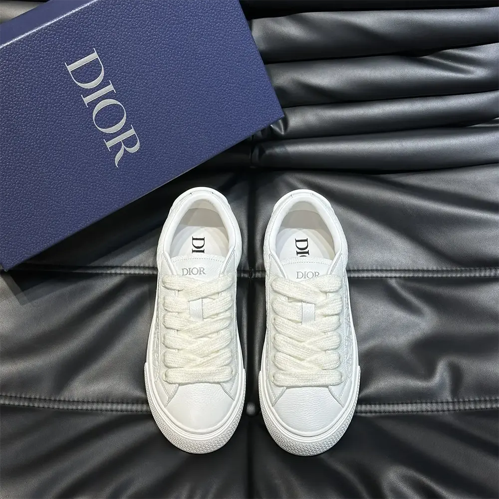 Close-up detail of white Dior Gravity leather embossing on Dior Men B33 Sneaker