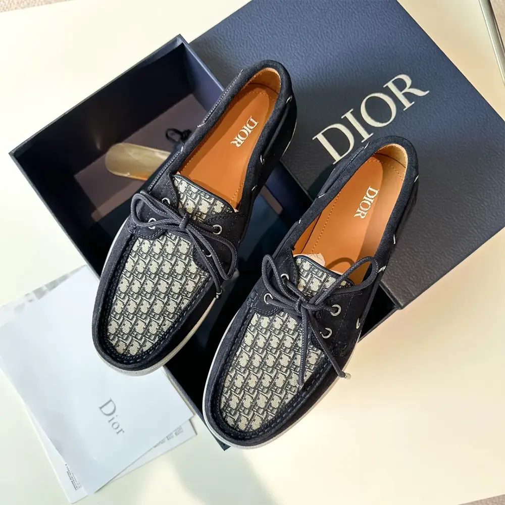 Close-up of navy suede and beige black Dior Oblique jacquard detail