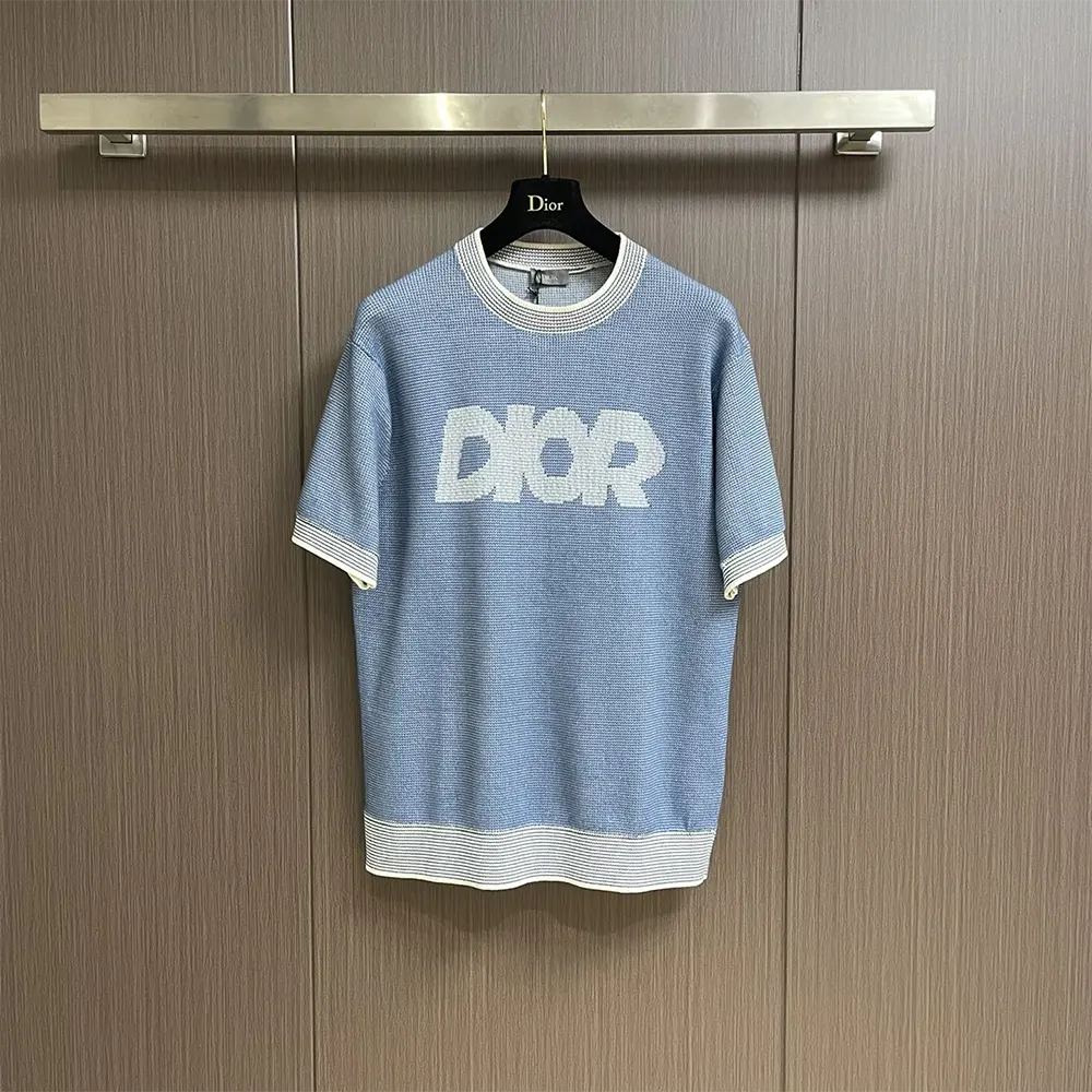 Close-up on tramato knit texture of Dior Men Italic T-Shirt blue fabric