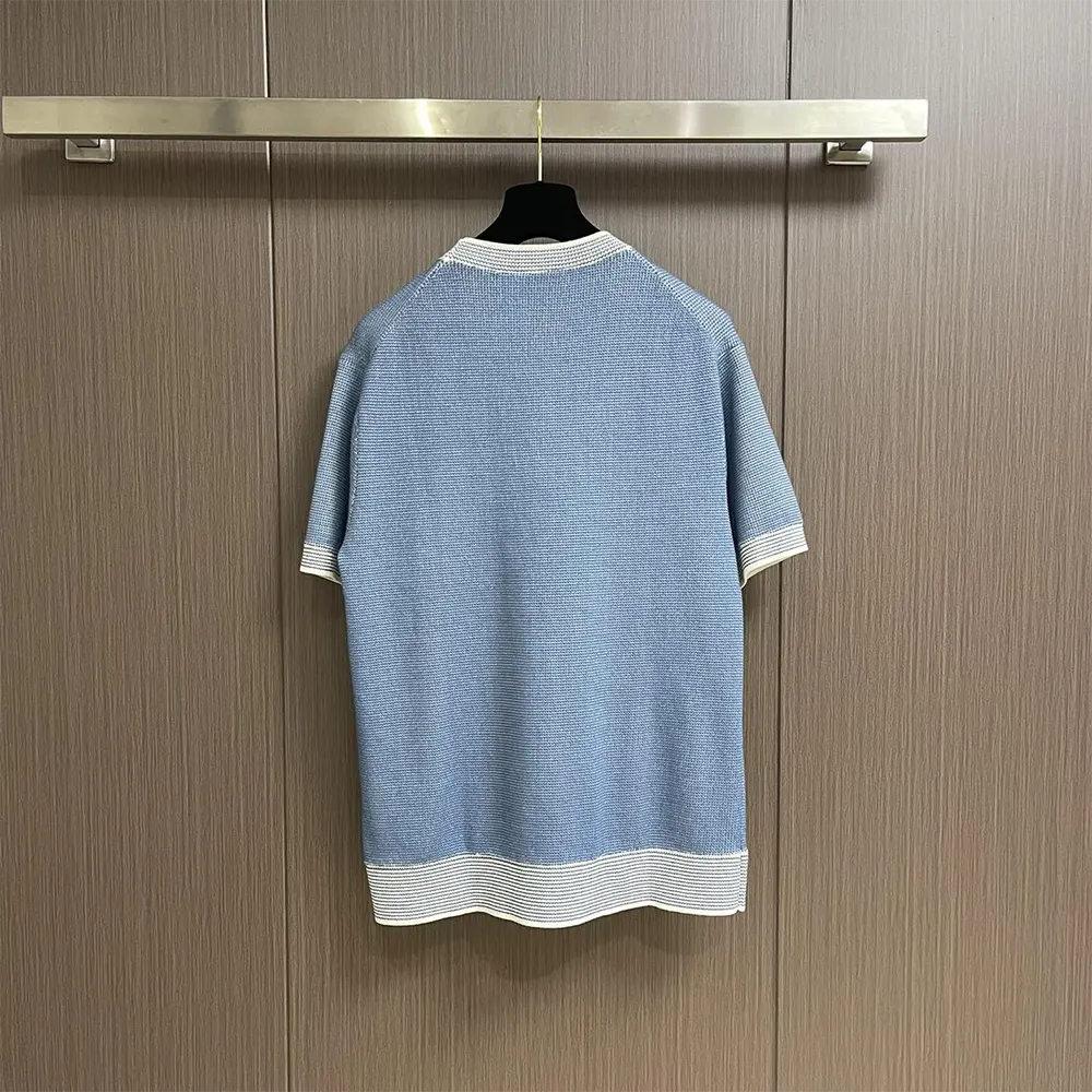 Side angle showing Dior signature detail on blue cotton-blend t-shirt