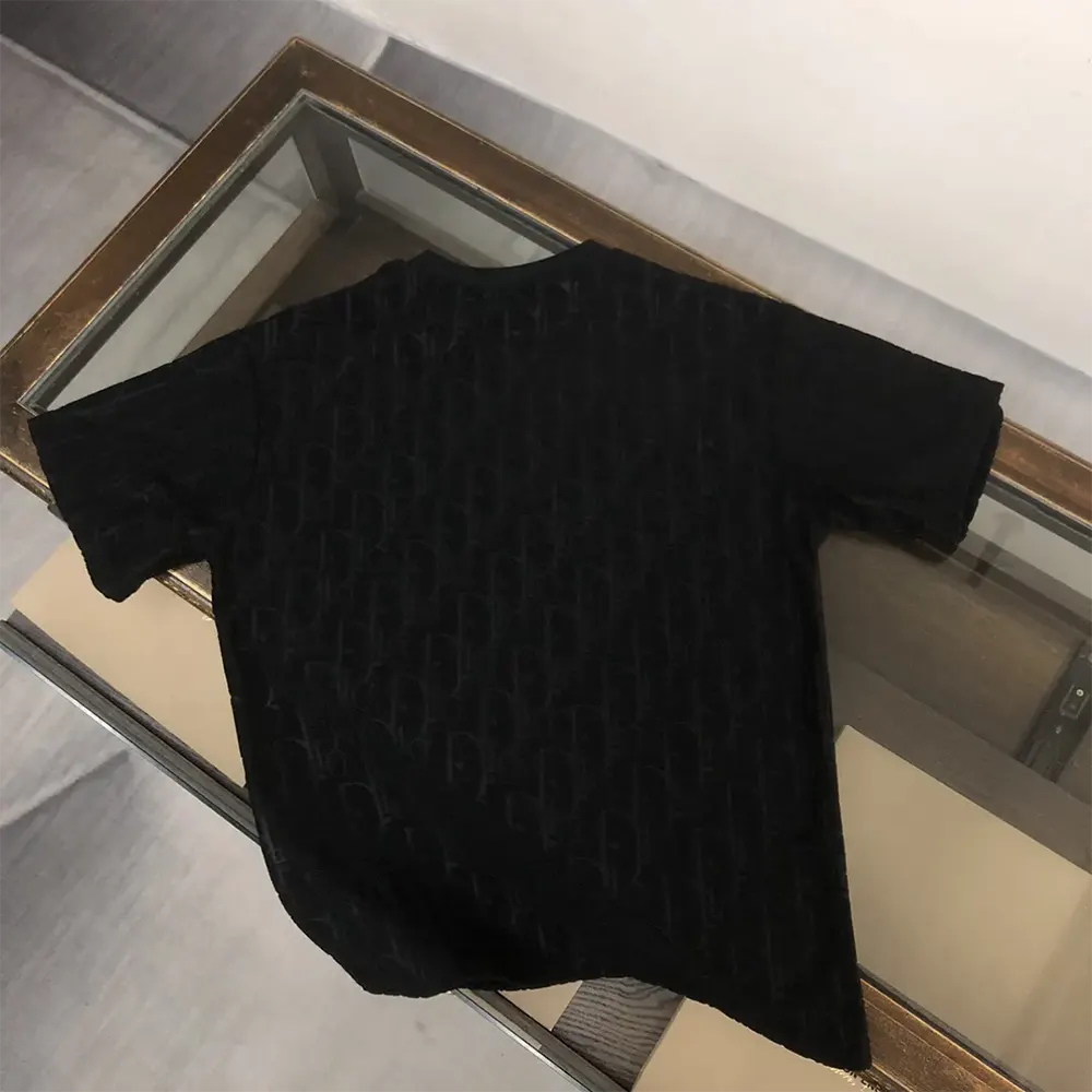 Side angle showing relaxed-fit silhouette of Dior Men Oblique T-Shirt