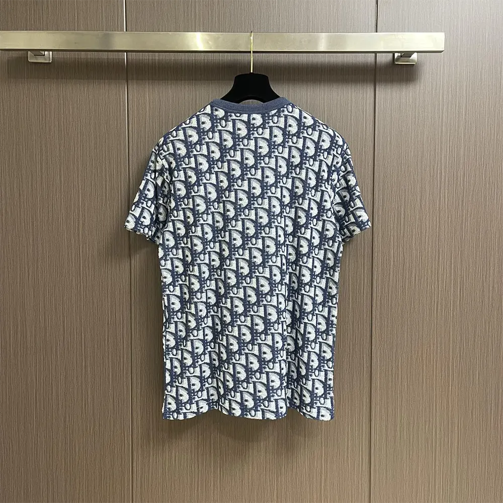 Side detail showing relaxed fit and fabric texture of Dior Men Oblique T-Shirt
