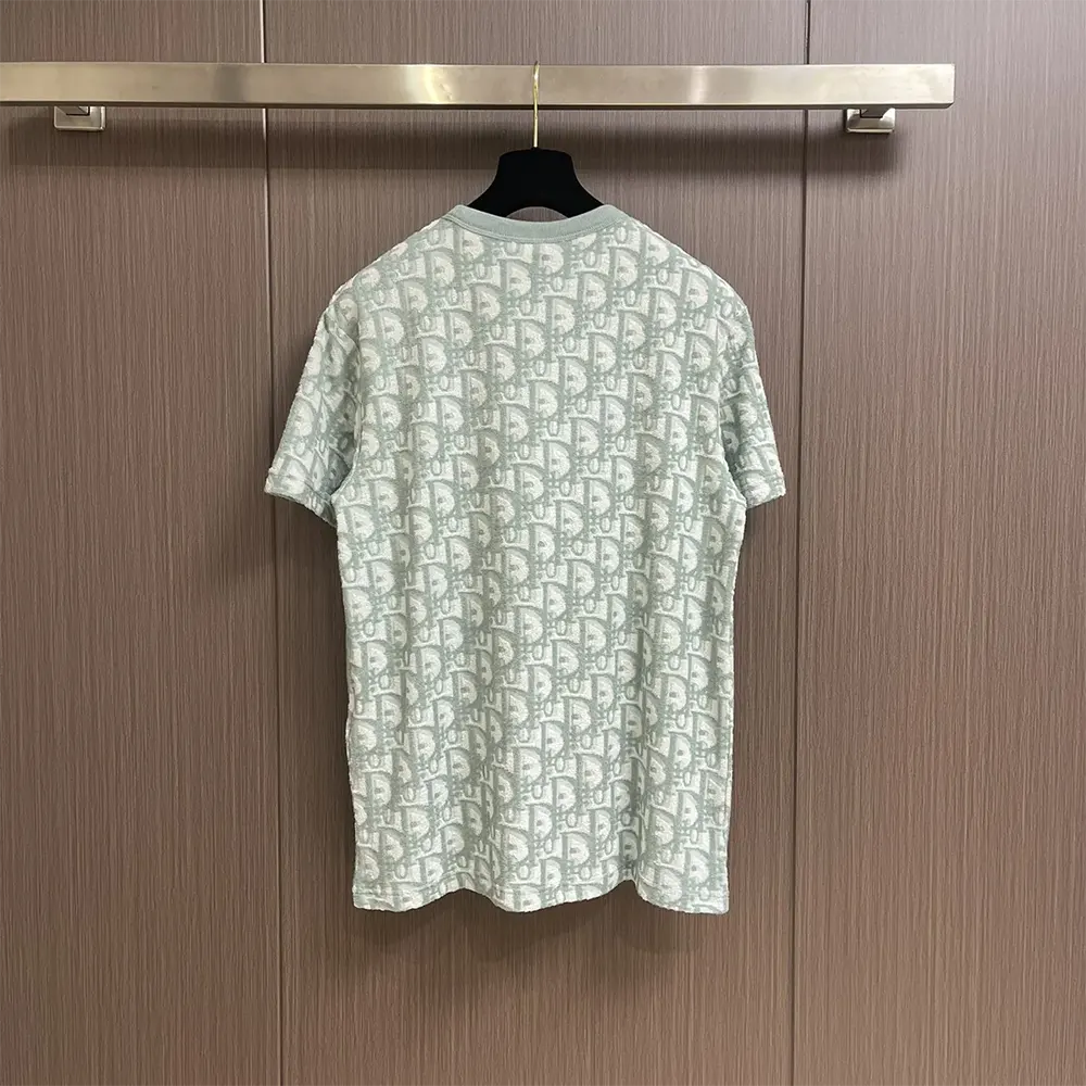 Side angle showing relaxed fit and texture of Dior Men Oblique T-Shirt