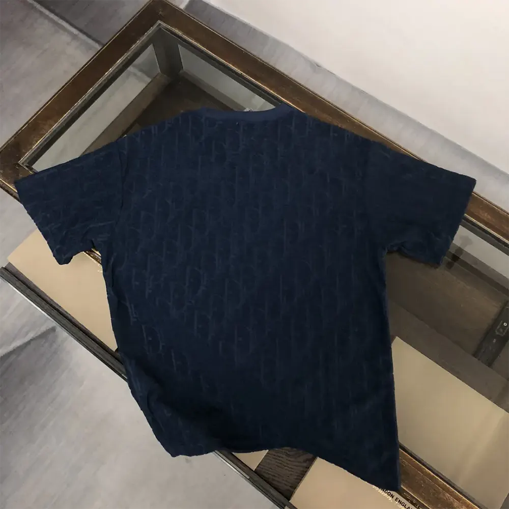 Side angle showing relaxed fit of Dior Men Oblique Navy Blue terry cotton tee