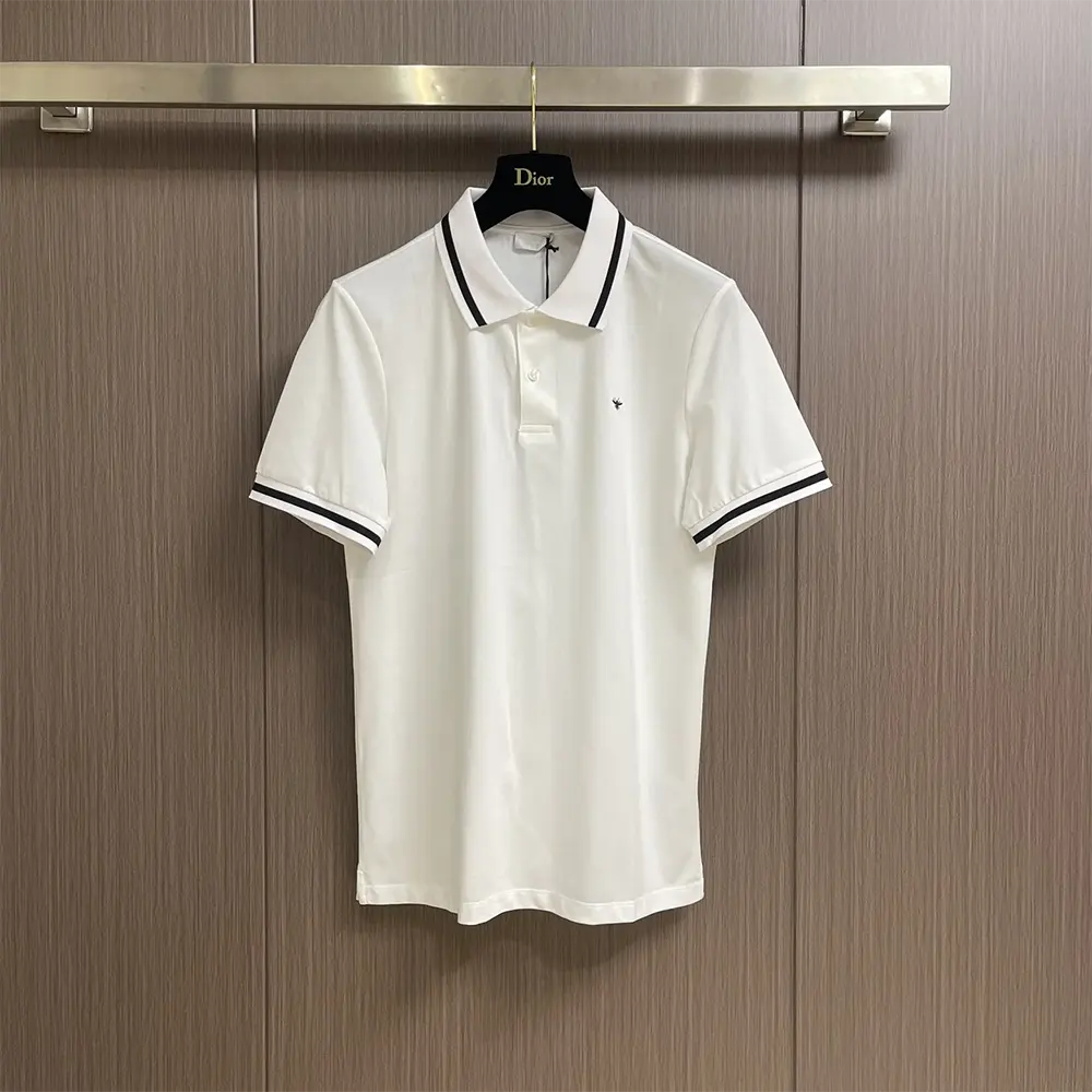 Close-up of bee embroidery detail on Dior Men Polo Shirt white piqué