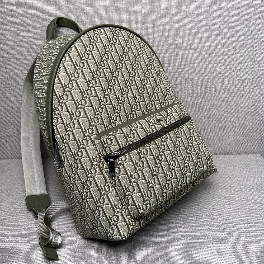 Side angle showcasing silhouette of Dior Men Rider Backpack Khaki Dior Oblique