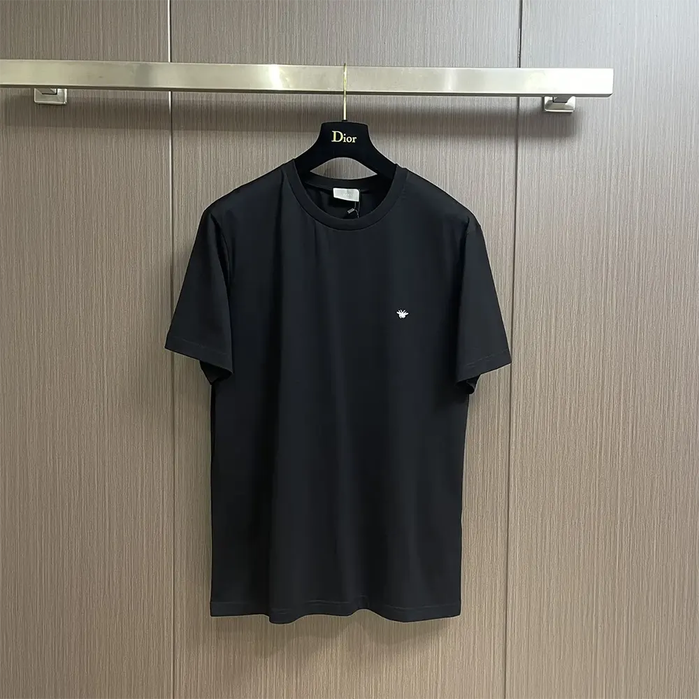 Close-up of gold bee embroidery on Dior Men T-Shirt black cotton fabric