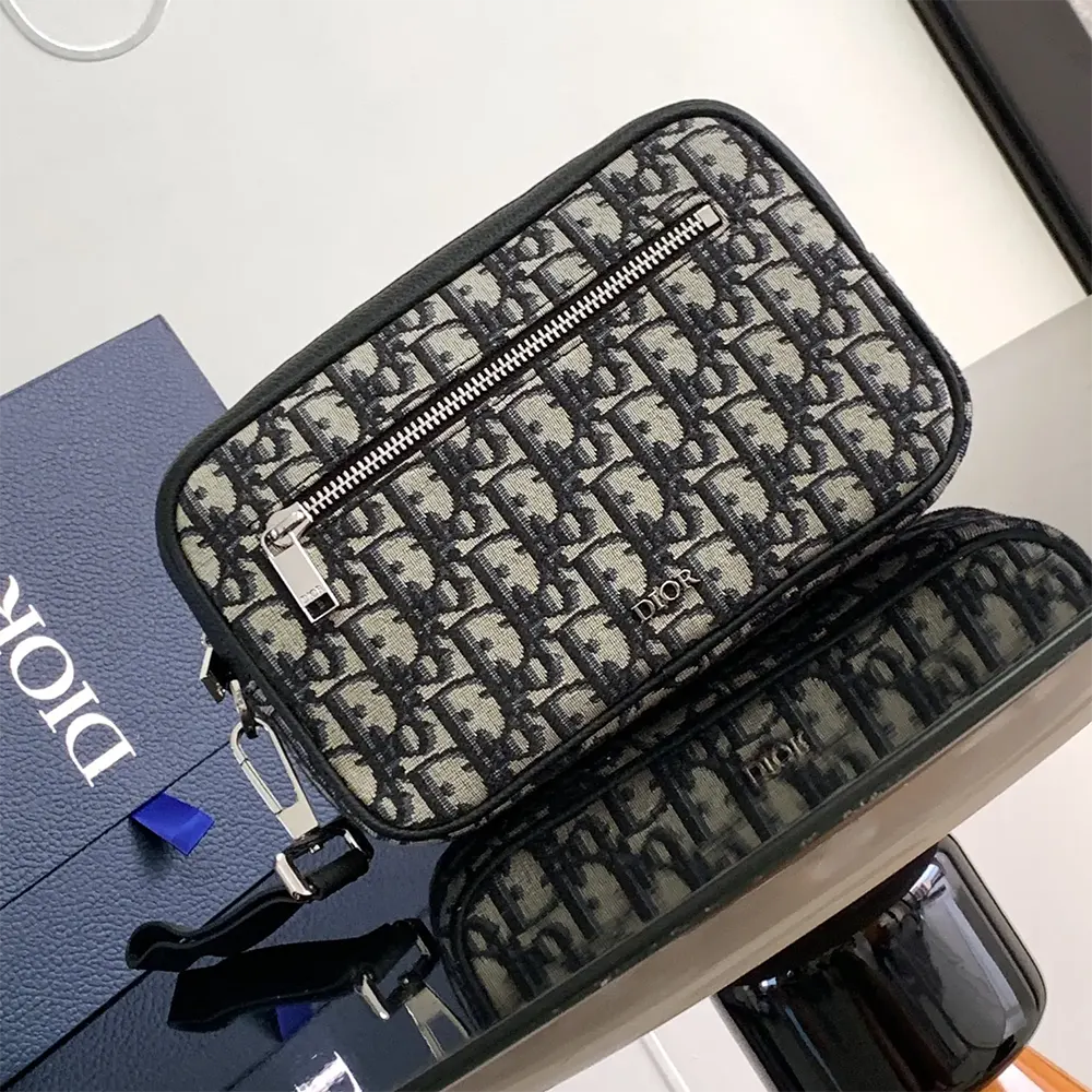 Close-up of zipper and silver hardware on Dior Men Toiletry Bag