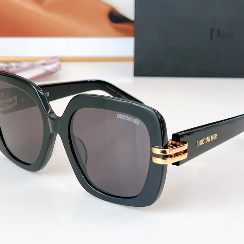 Close-up of Dior metal logo detail on the temple of CDior S1I Black Square Sunglasses