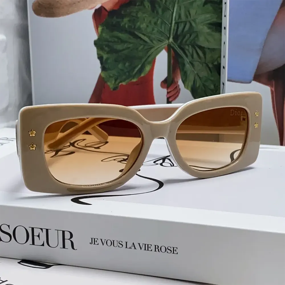 Close-up of pink acetate frame and silver Dior logo hardware