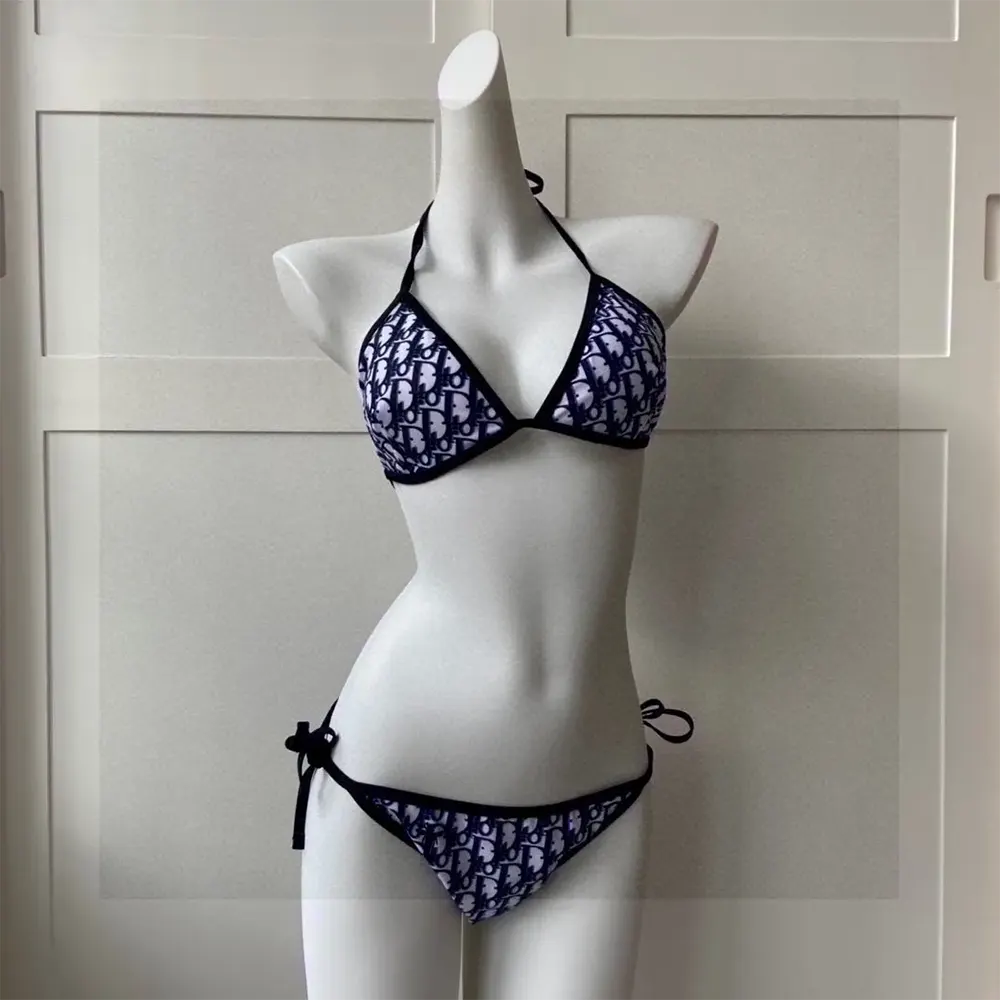 Close-up of embossed hardware on Dior Women Bikini Bottom in blue