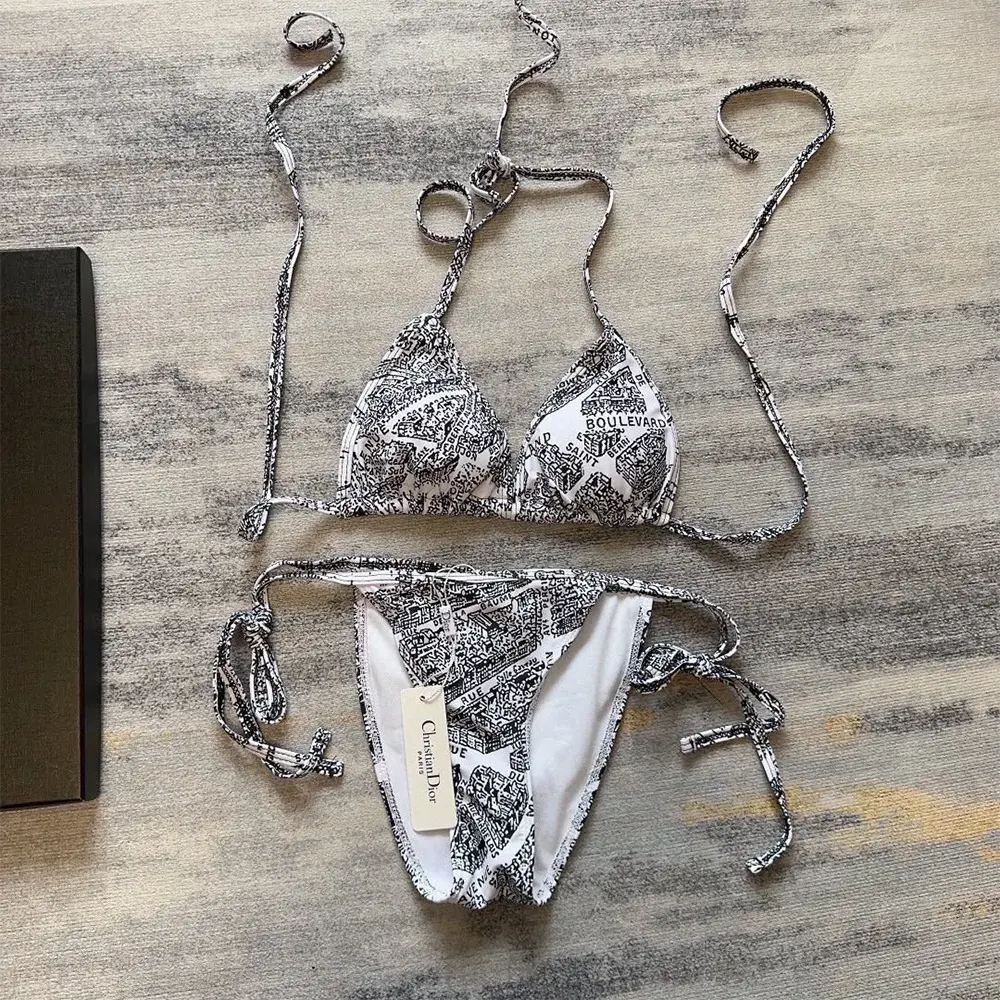 Close-up detail of the technical fabric and Dior logo hardware on bikini top
