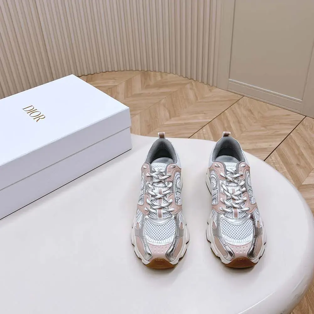 Close-up of pink laminated leather-effect panels and silver hardware on Dior Women Chrono Sneaker
