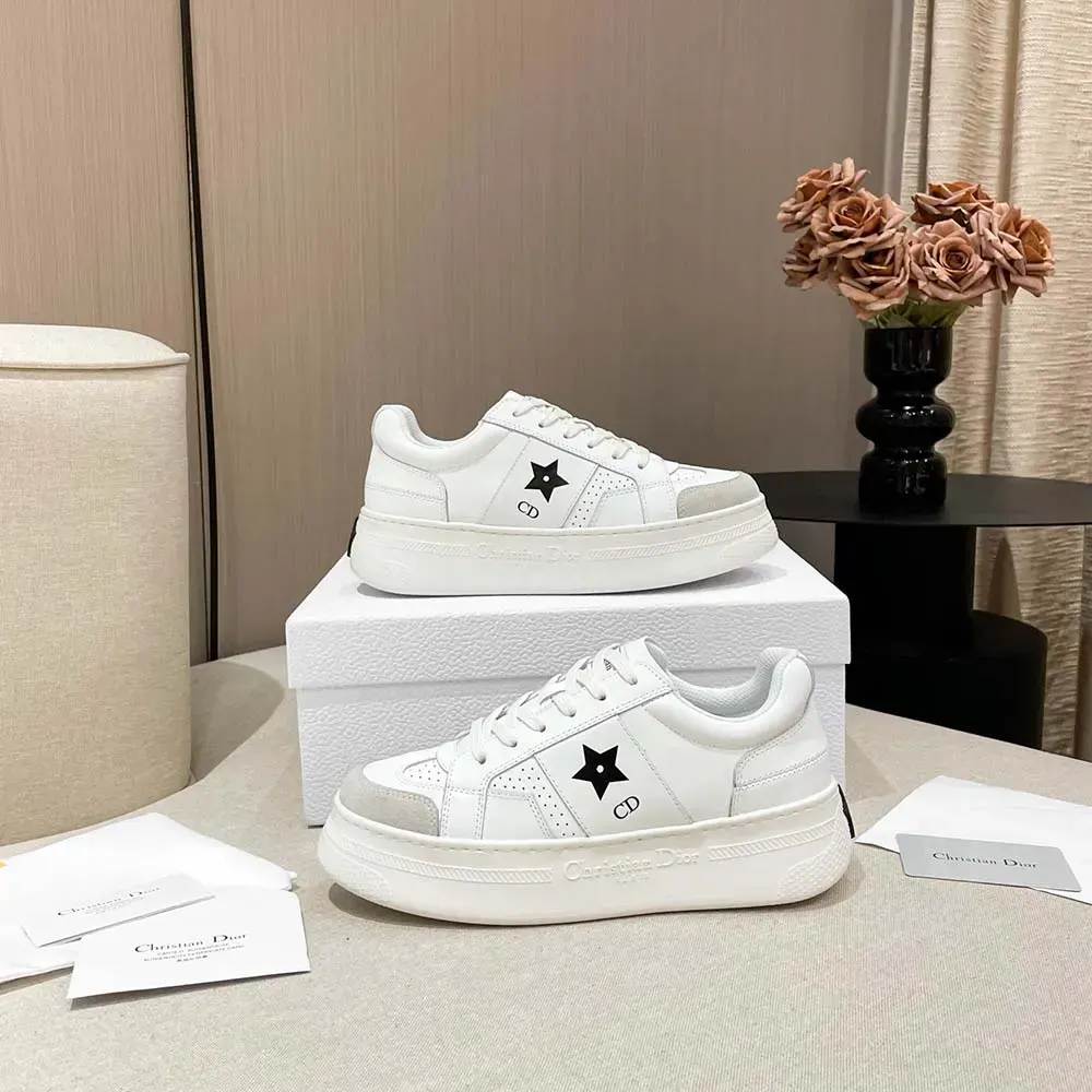 Overhead shot showing laces and suede texture on Dior white sneaker