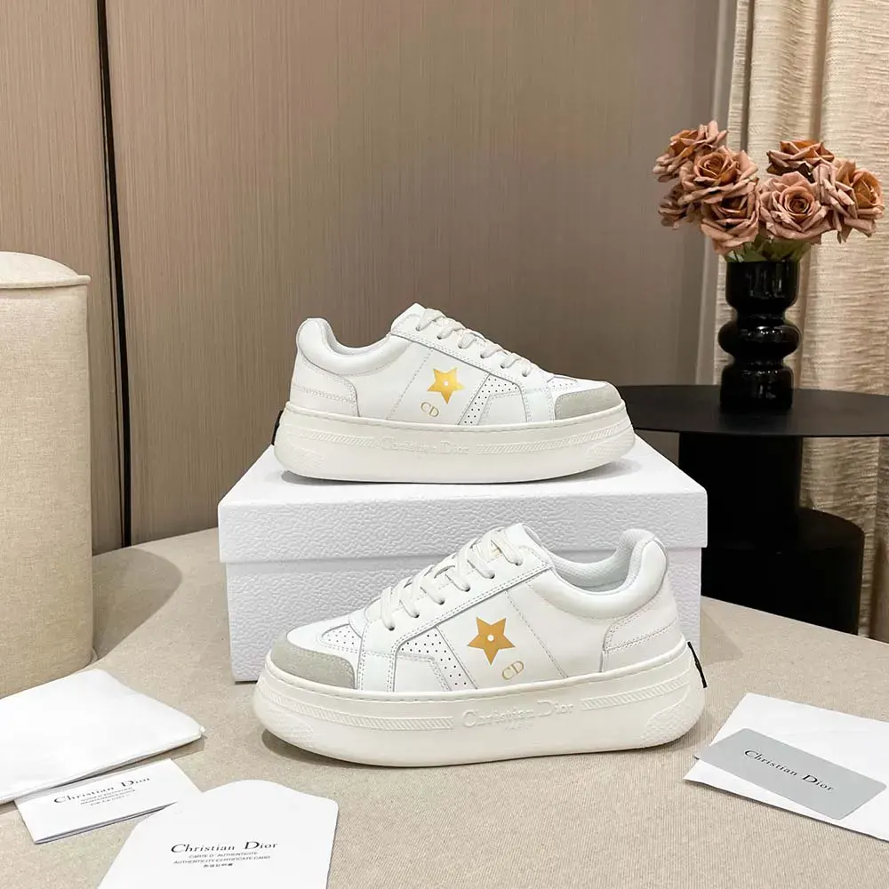 Close-up of Dior Star detail on white calfskin platform sneaker