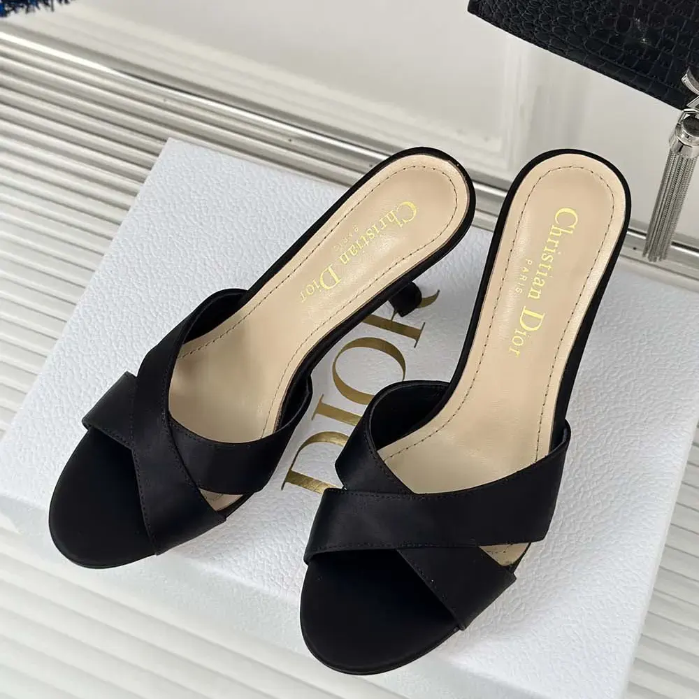 Top-down angle showing open toe and sleek heel of Dior Tribales slide
