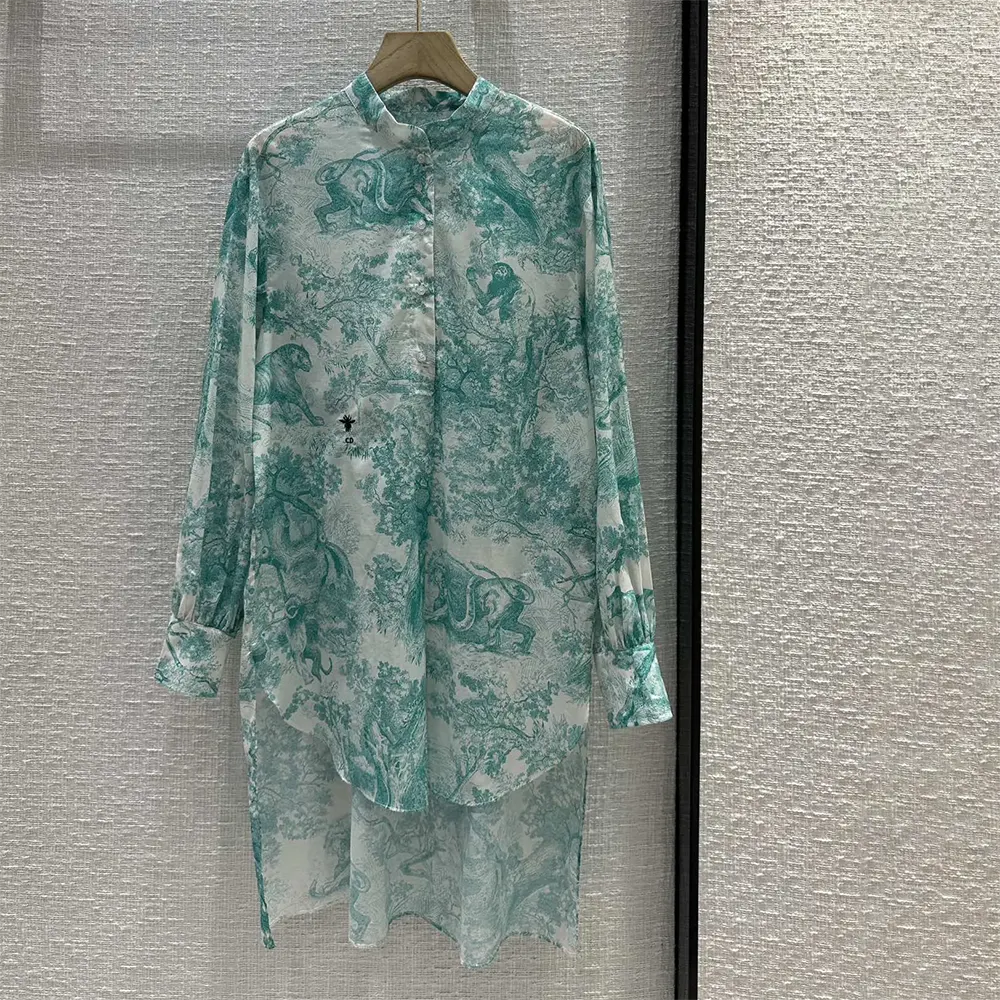 Close-up of embroidered Dior detail on Dioriviera Long Blouse cotton muslin