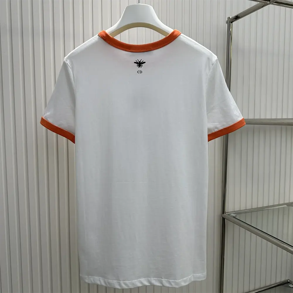 Side angle showing fit of Dior Men Dioriviera T-Shirt in orange coral