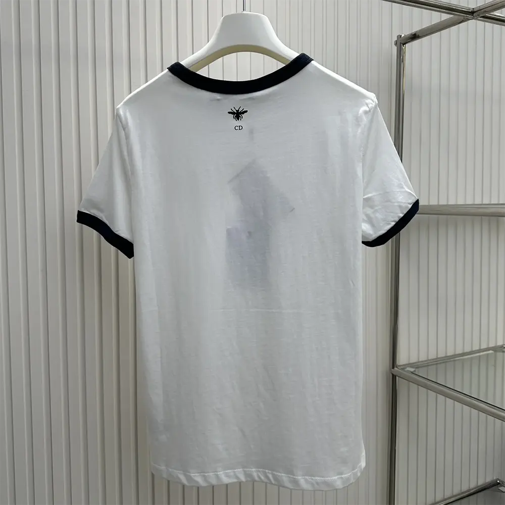 Side profile showing fit of Dior Men Dioriviera T-Shirt in navy blue