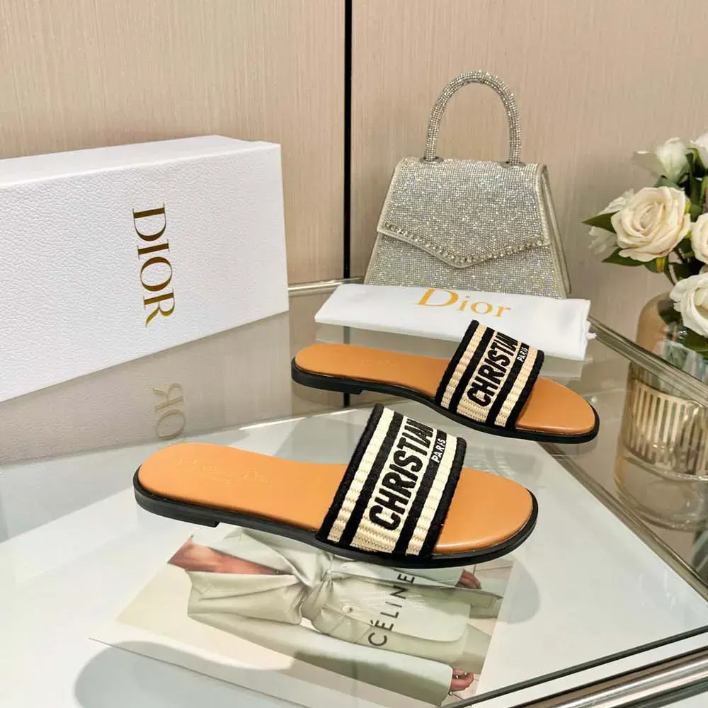 Close-up on embroidered black cotton upper of Dior Women Dway Slide