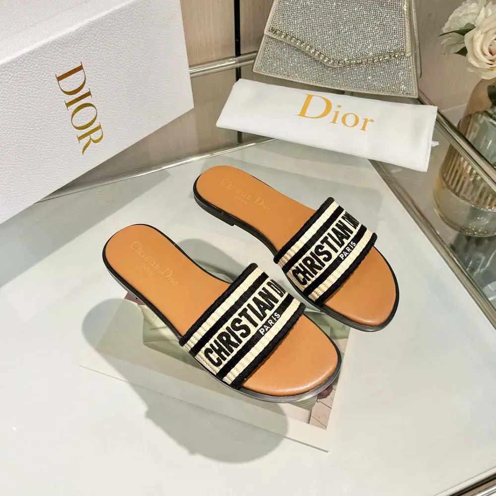 Top-down angle showing raffia weave and slide silhouette of Dior Women Dway Slide