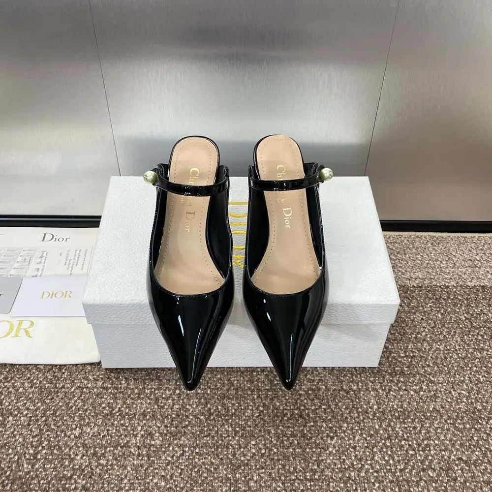 Close-up of glossy patent leather and gold hardware on Dior Jolie Mule