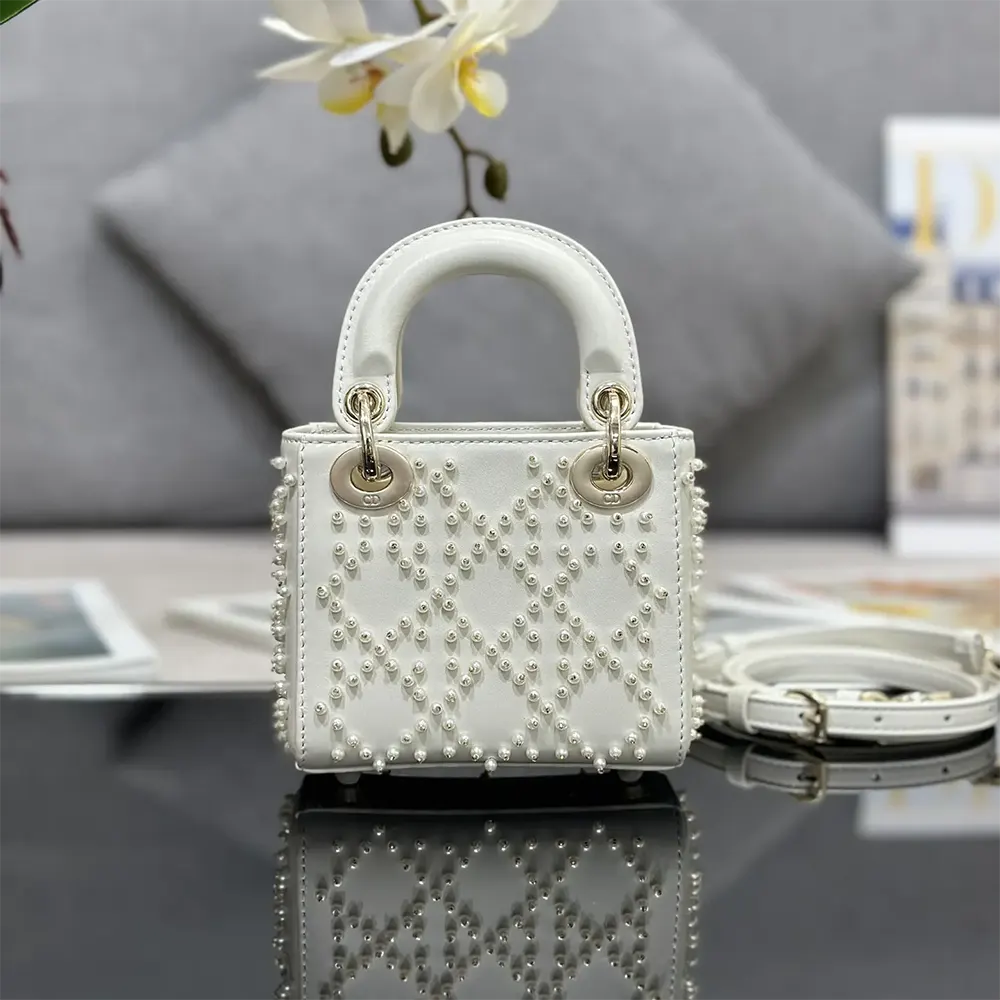 Side profile showing micro silhouette and adjustable strap of Lady Dior Micro Bag