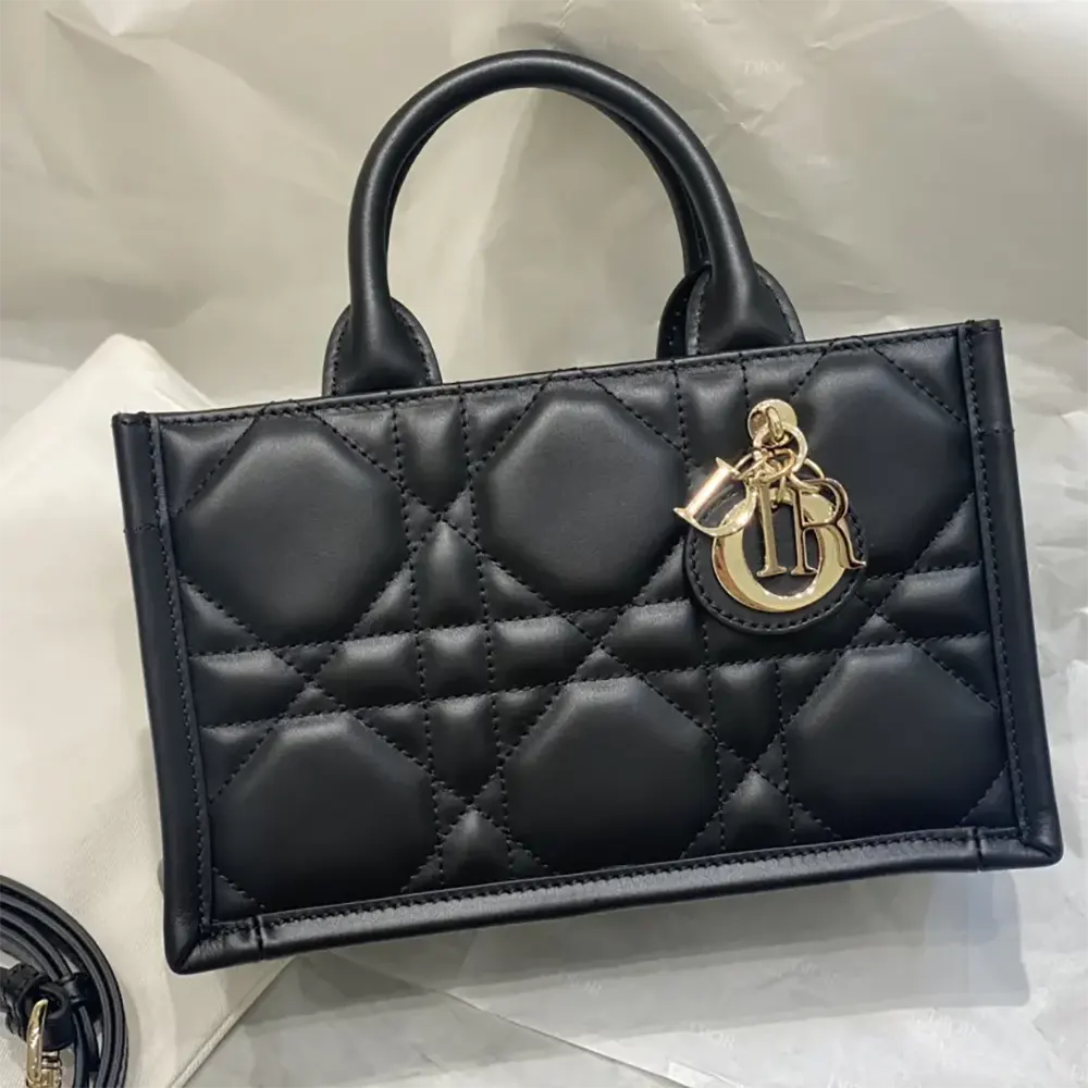 Side angle showing silhouette and strap details of Mini Dior Book Tote Black Calfskin