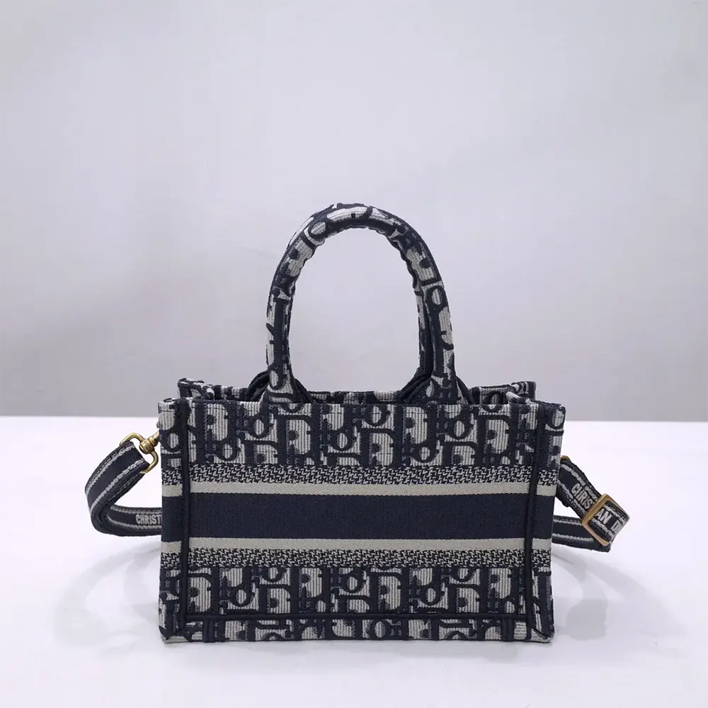 Side angle showing structured silhouette and silver hardware on mini tote