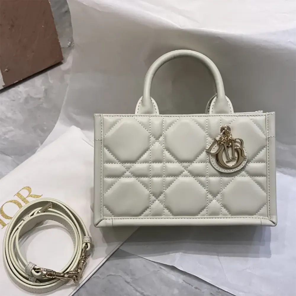 Close-up of gold hardware and Macrocannage stitching on Dior Women Mini Dior Book Tote Latte Macrocannage Calfskin