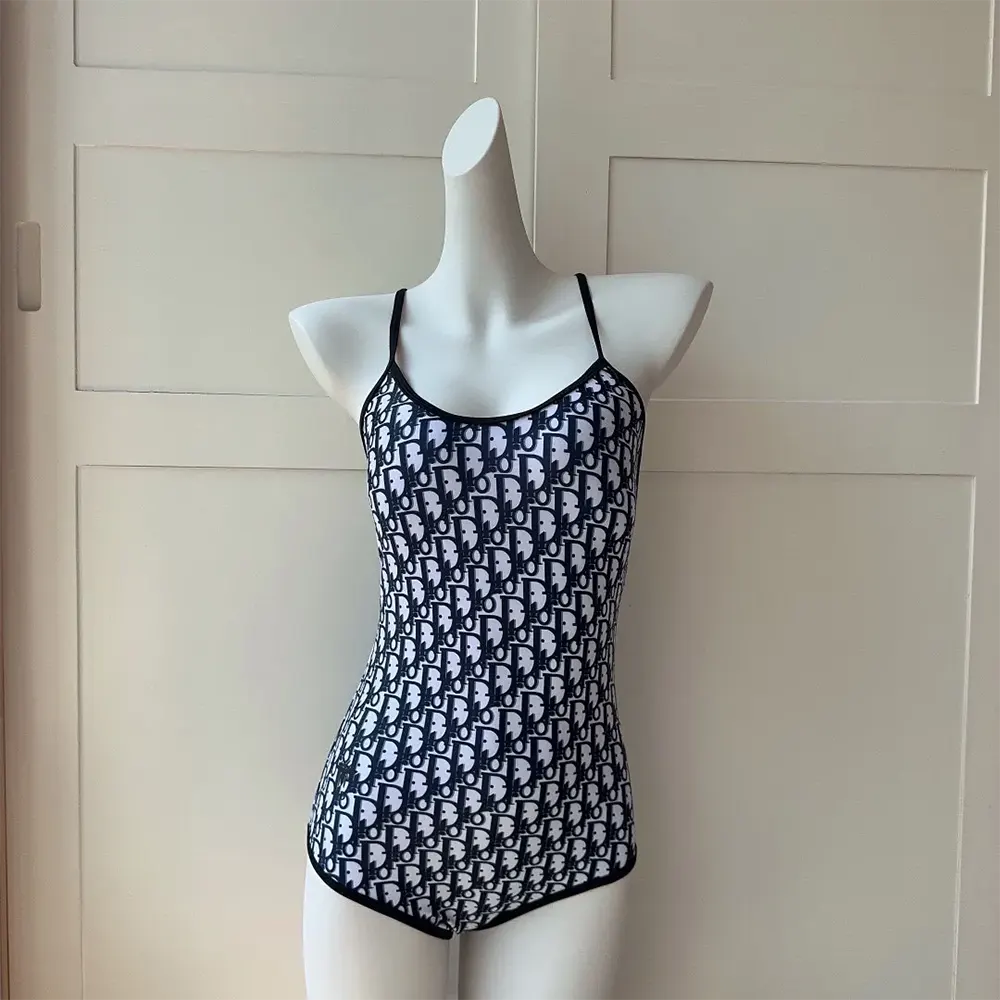 Close-up detail of technical fabric pattern on Dior Women One-Piece Swimsuit