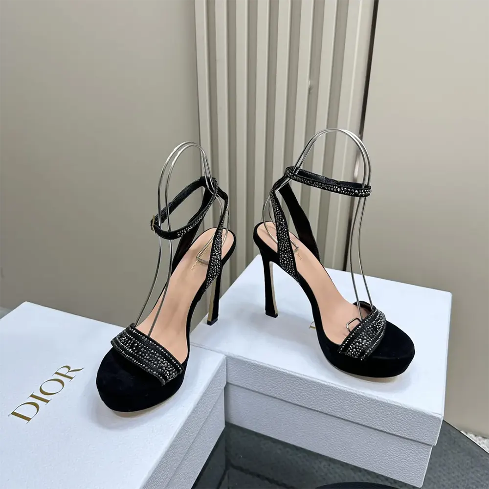 Top angle showing black ankle buckle on Dior Women Or Dway Heeled Sandal