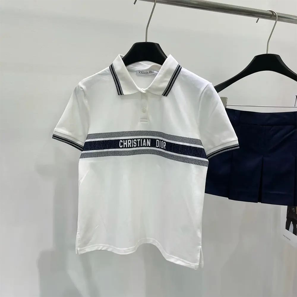 Close-up of embroidered Dior logo on polo shirt collar