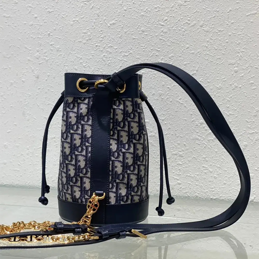 Side angle showing silver hardware on Dior Women Small Dior Backpack