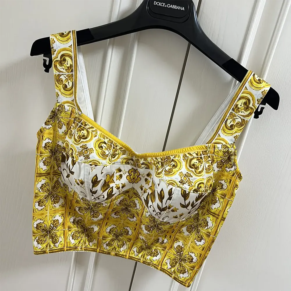Side angle showing corset silhouette of Dolce Gabbana D&G cotton top