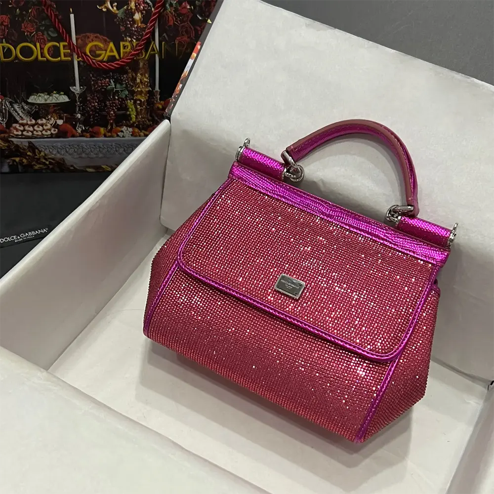 Close-up of gold-tone hardware on Dolce Gabbana D&G Mini Sicily handbag