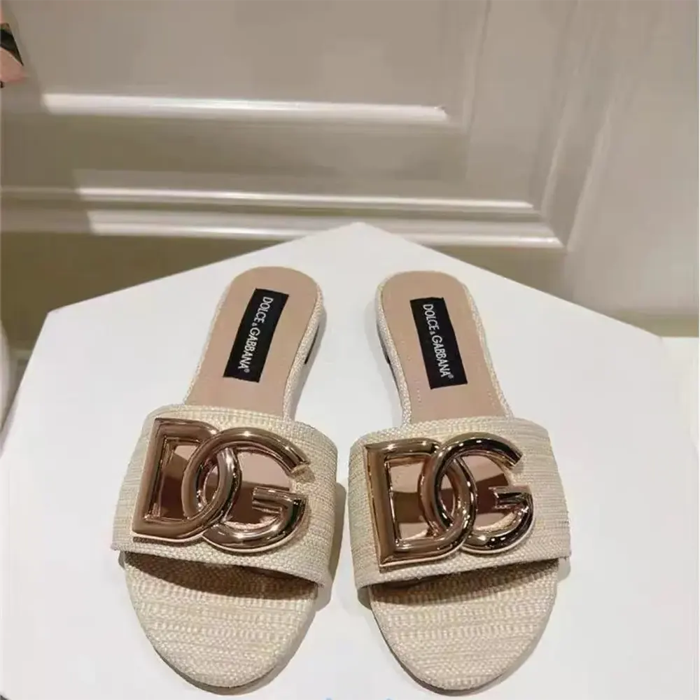 Close-up of gold D&G logo hardware on Dolce Gabbana D&G Women Raffia Sliders