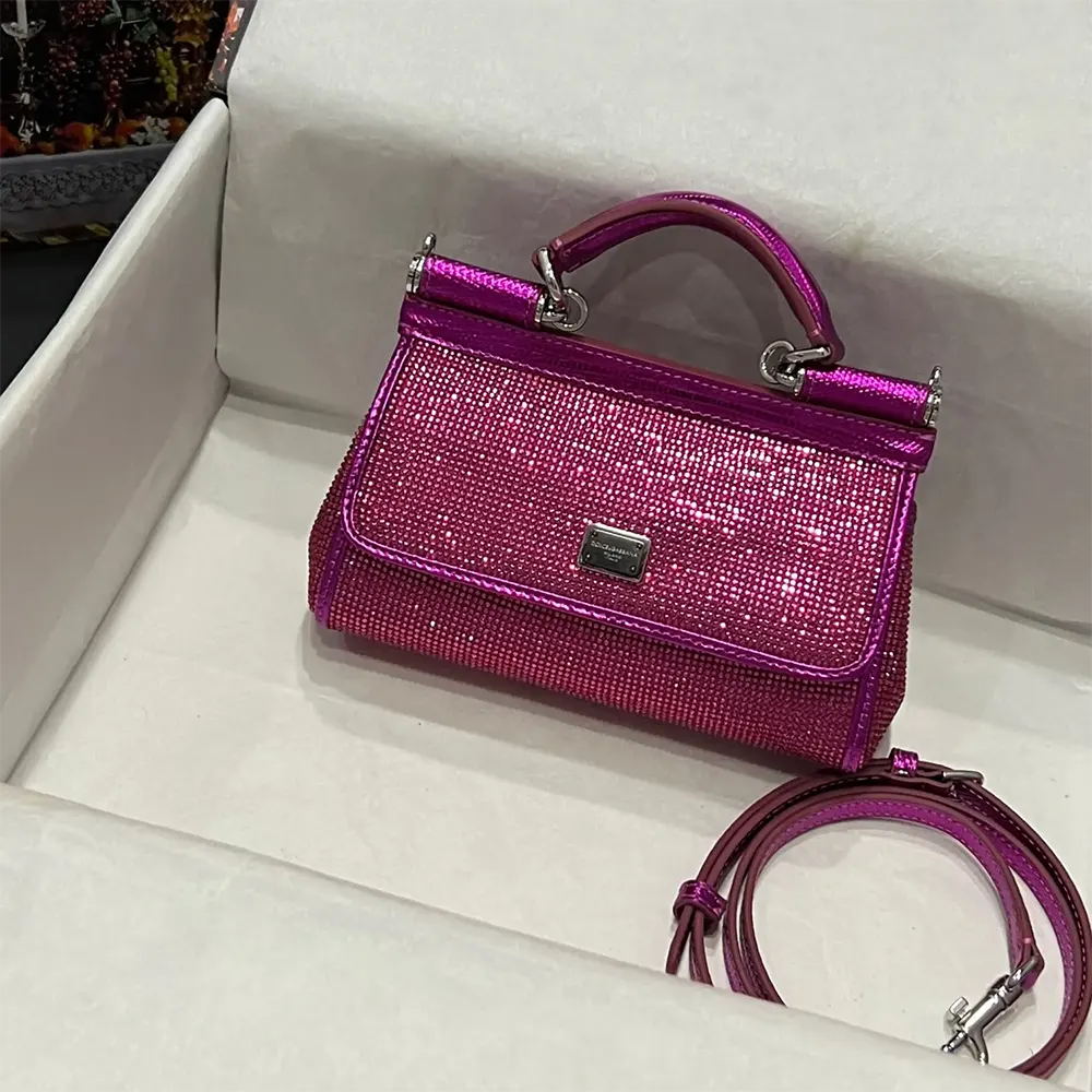 Close-up of gold-tone D&G logo hardware on Small Sicily Handbag